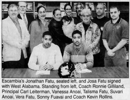 The Usos signing their letter of intent to play for the University of West Alabama